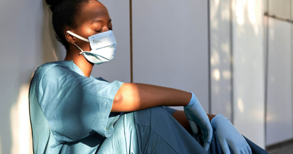 exhausted nurse experiencing burnout